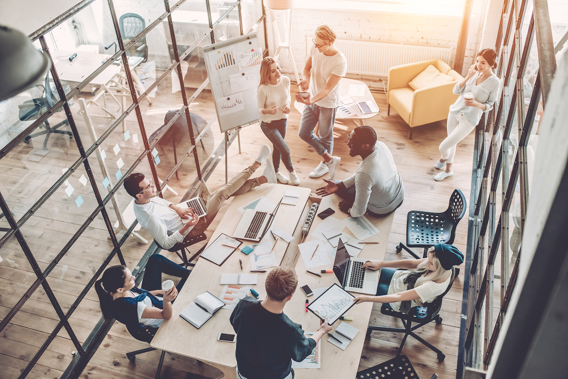 Large group of business professionals working in a modern IT company office