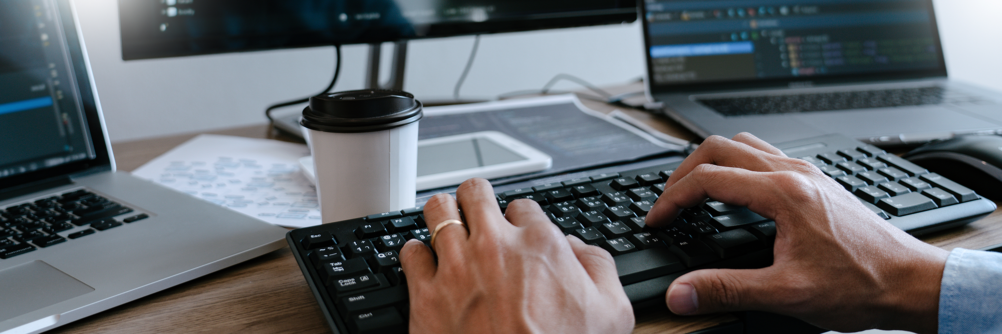 Programmer hands typing on keyboard