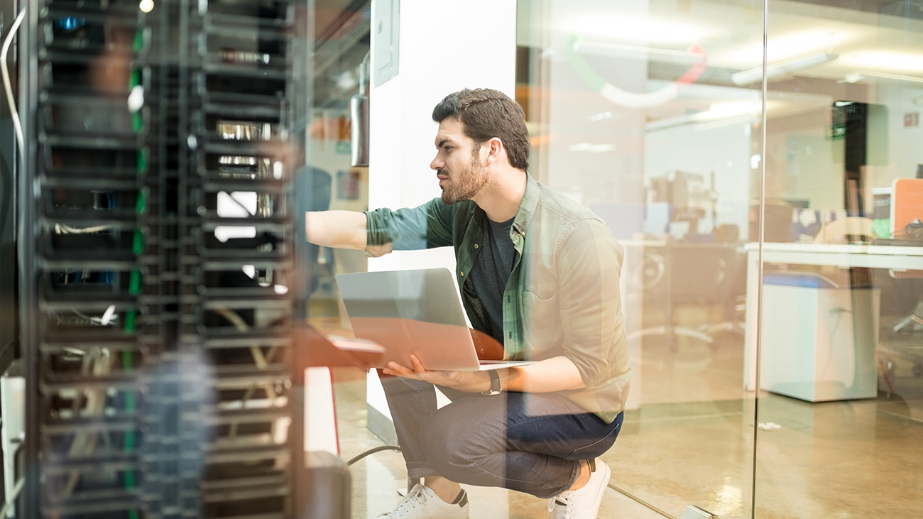 Network administrator working in server room