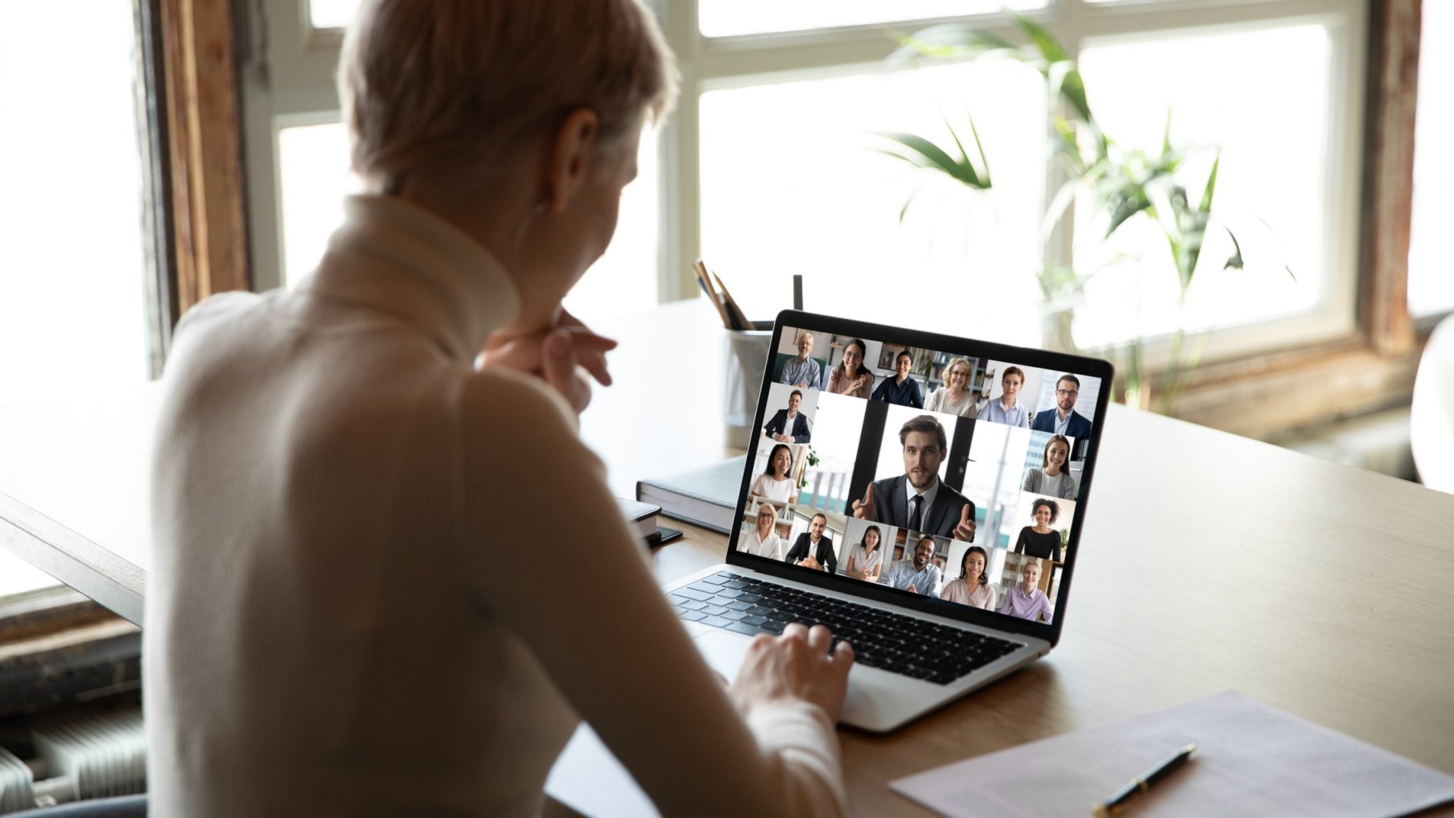 Team leader at home office on video conference call